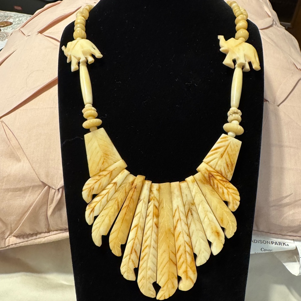 Bone necklace with elephants, handmade.